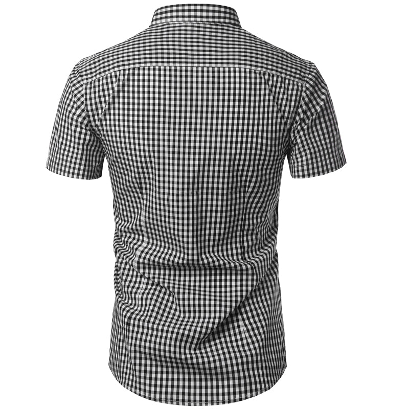 Back view of the black and white gingham shirt showing the yoke seam, short sleeves and curved hem. 8