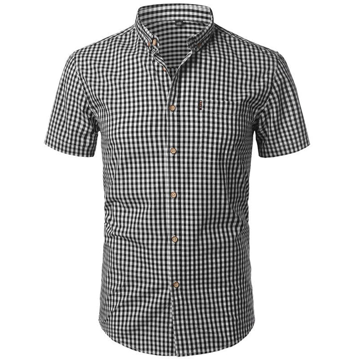 Front view of a black and white gingham shirt with short sleeves, button-down collar, chest pocket and wooden-look buttons. 7
