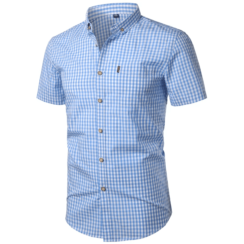 Angled three-quarter view of the light blue gingham shirt with the buttoned front, chest pocket and short sleeves.