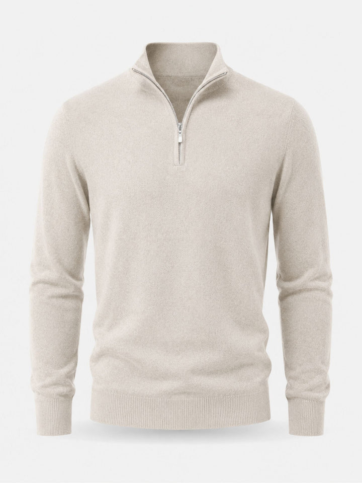 Flat front view of the cream quarter-zip knit sweater with stand collar, silver zipper, ribbed cuffs and ribbed hem.