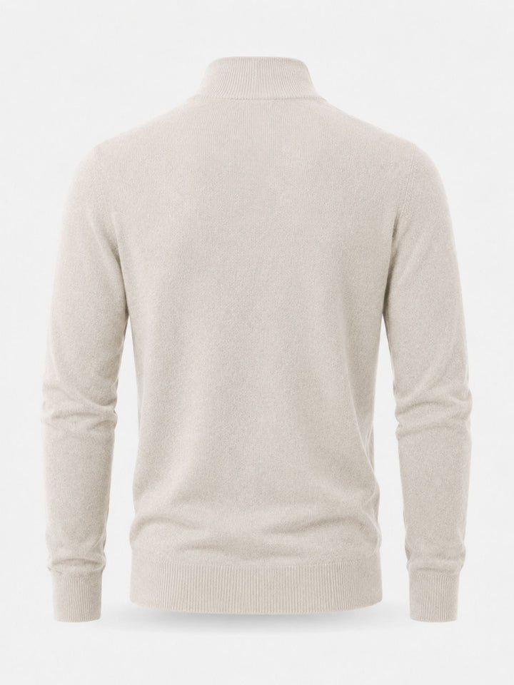Flat back view of the cream knit sweater showing the plain back panel, ribbed collar, cuffs and hem.