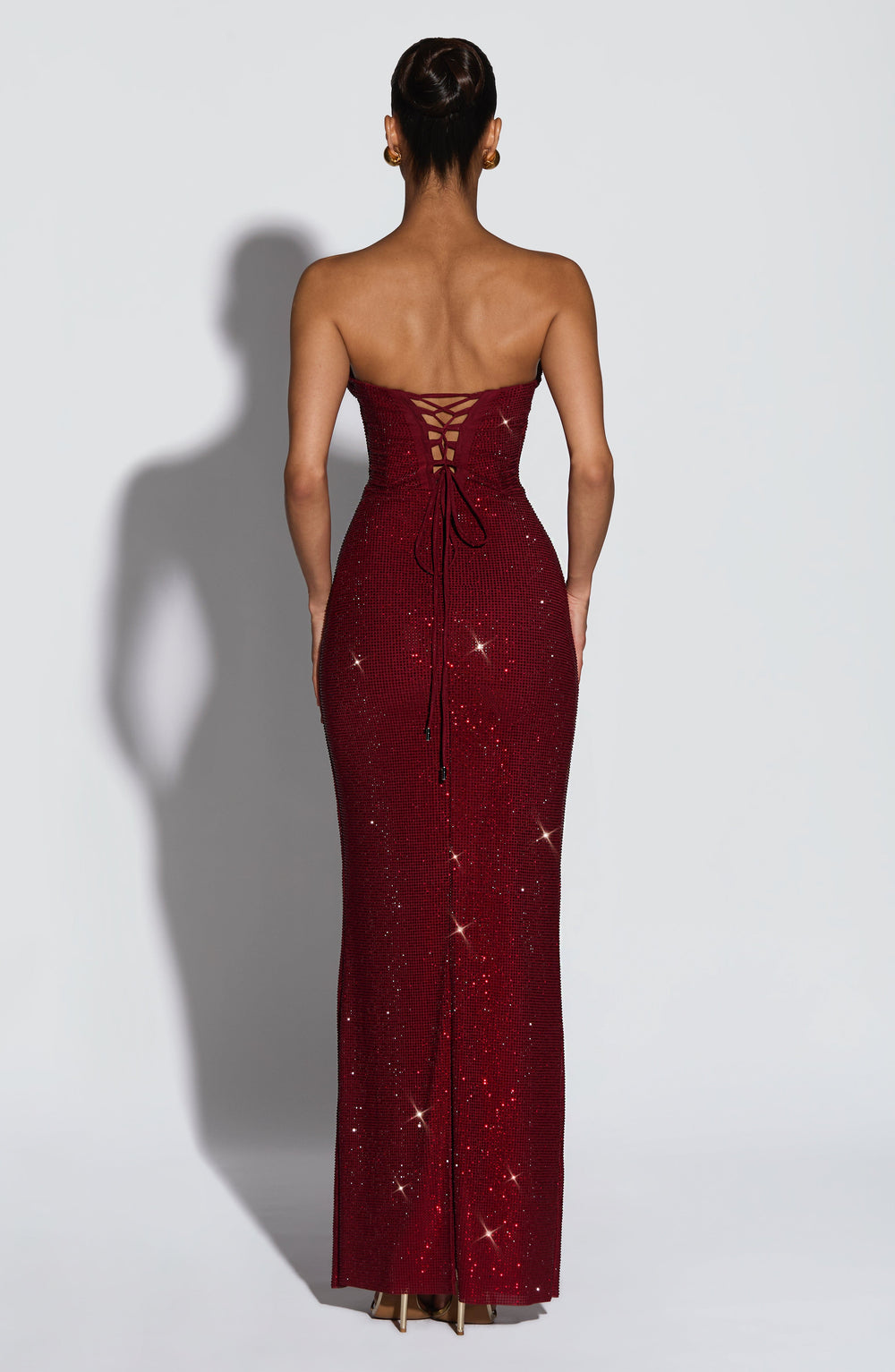 Back view of the burgundy dress showing the lace-up corset back with long hanging ties 2