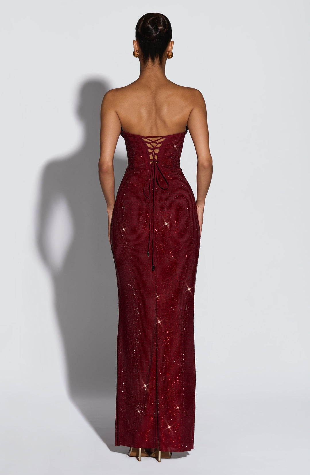 Back view of the burgundy dress showing the lace-up corset back with long hanging ties 2