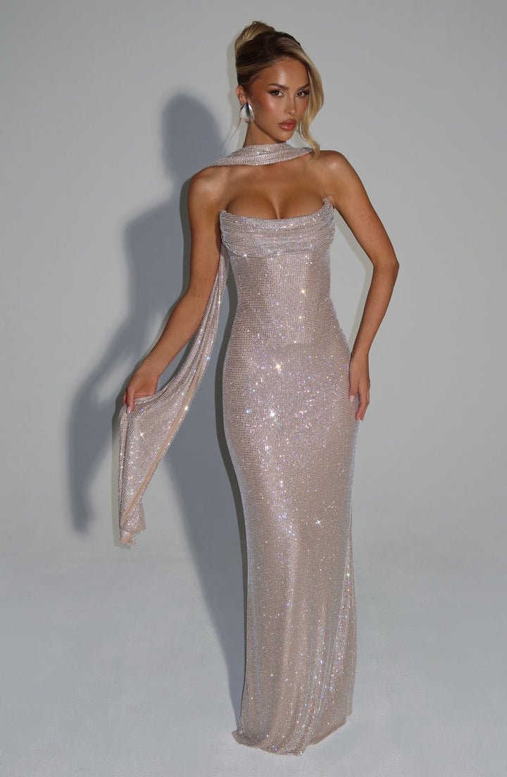 Champagne rhinestone dress styled with a matching draped scarf over one shoulder, held out by the model 17