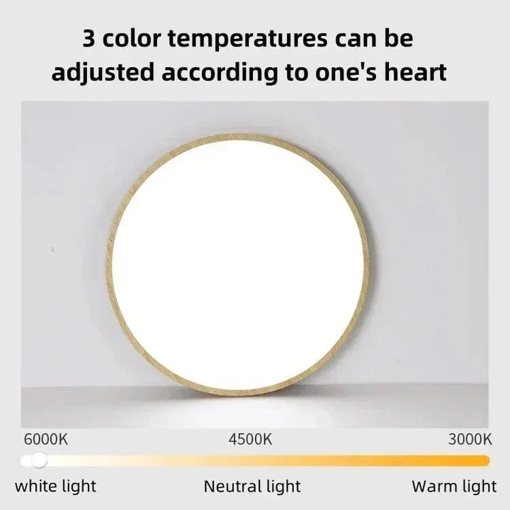 Light wood-finish round light lit up with three adjustable color temperatures from warm to white.