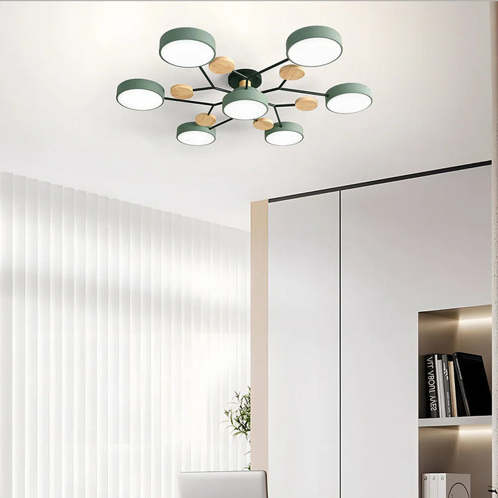 Green seven-light chandelier on a white ceiling in a bright room with sheer vertical curtains and built-in shelves. 4