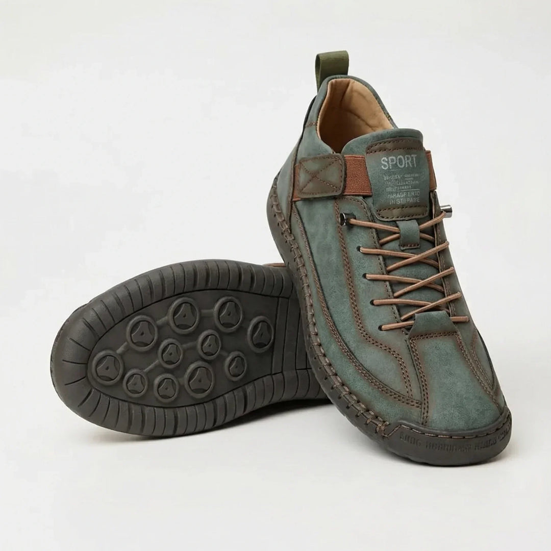 Green sneakers with brown elastic laces and brown trim, paired with one shoe flipped to show the sole 5