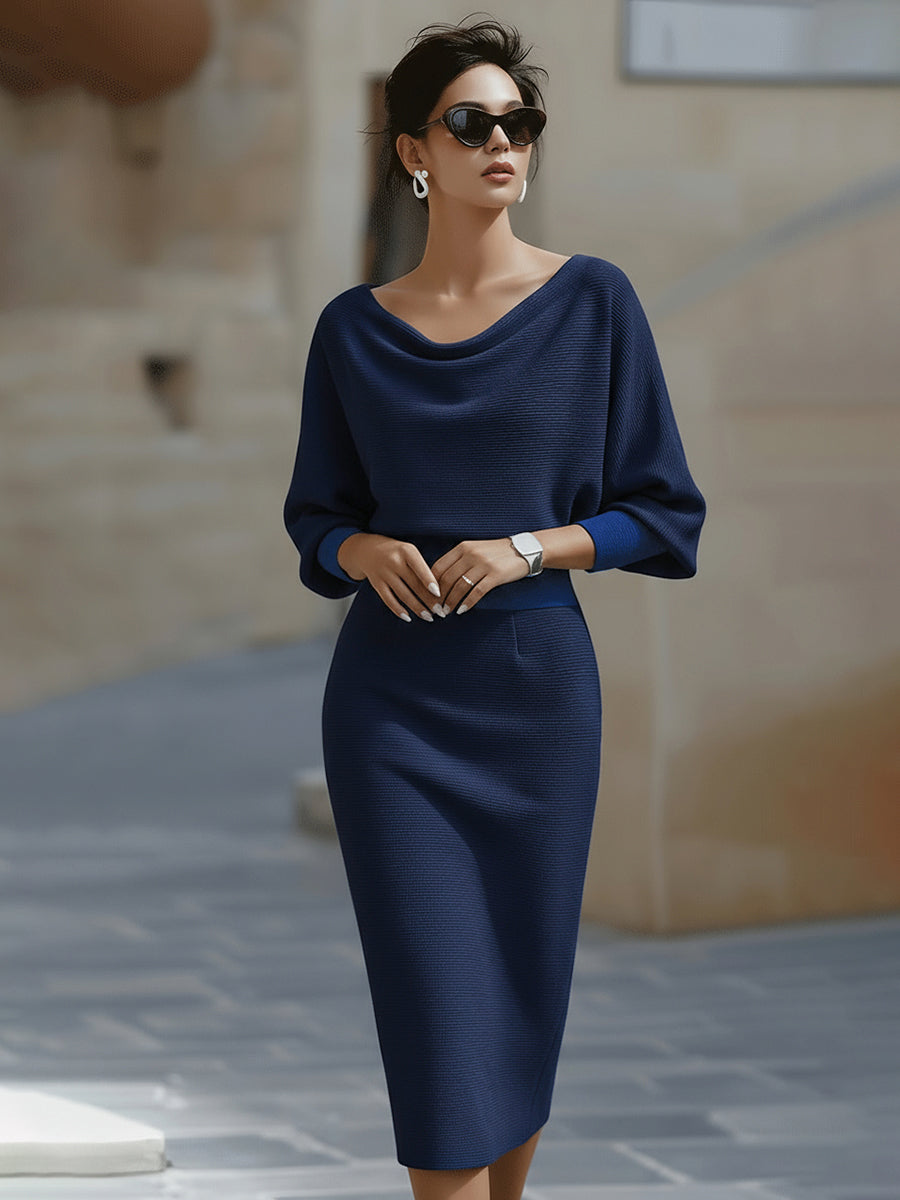 Model in the navy blue dress with brighter blue cuffs and waistband, wearing sunglasses 6