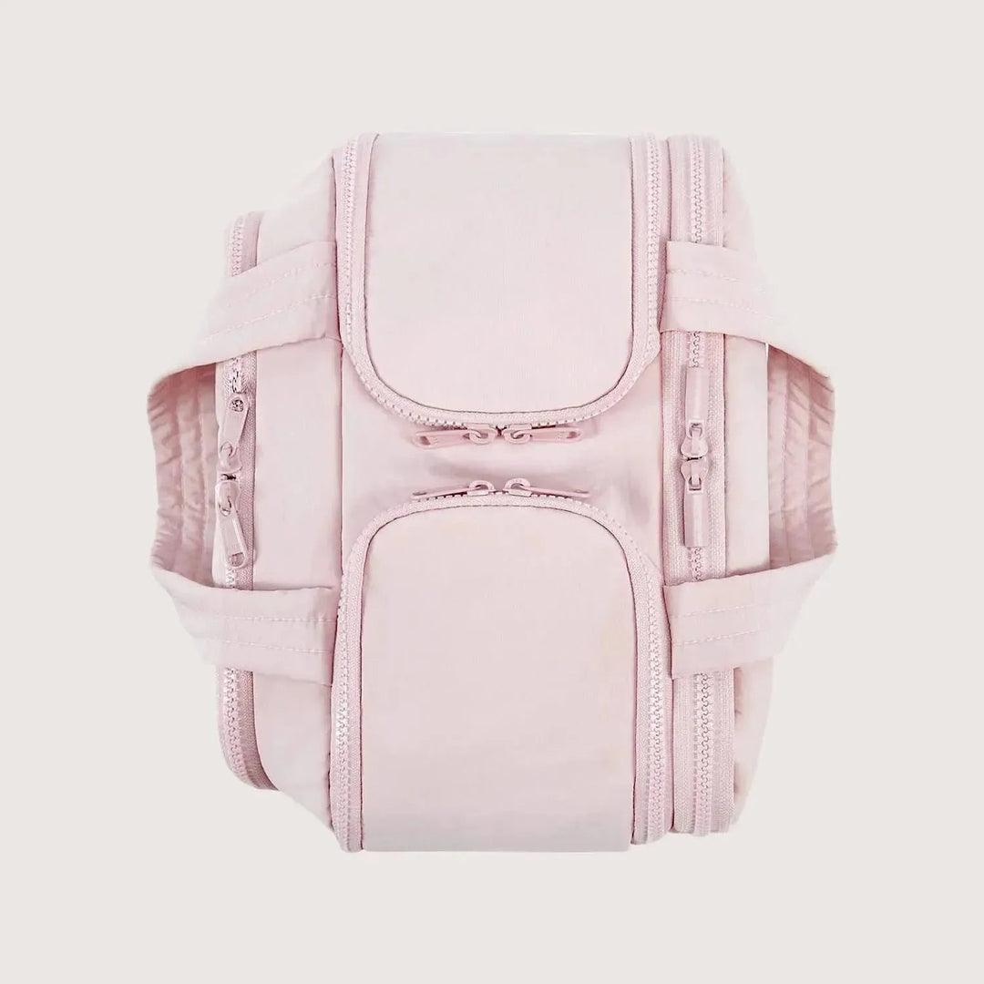 Top-down view of the pink bag with its zippered compartment flaps closed and both handles laid out flat to the sides. 11