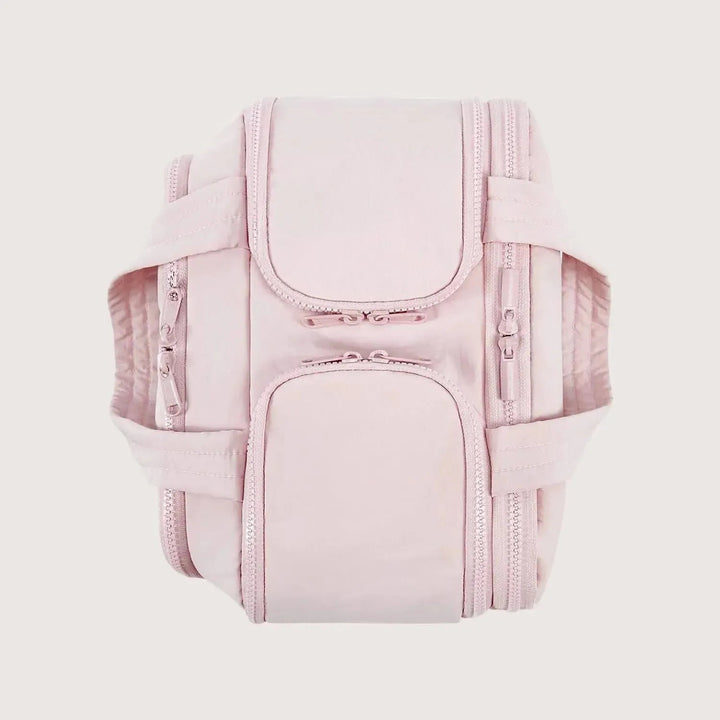 Top-down view of the pink bag with its zippered compartment flaps closed and both handles laid out flat to the sides. 11