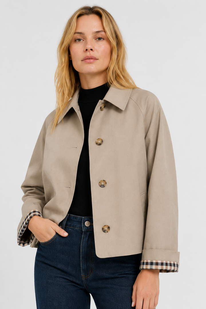 Women's beige lightweight jacket with a gingham cuff lining, front close-up.