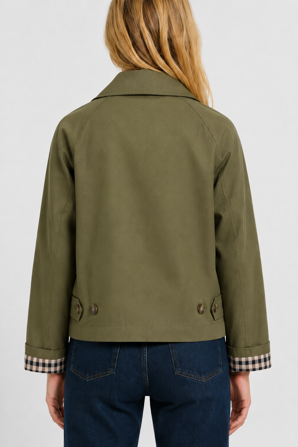 Women's olive green lightweight jacket, back view with two buttoned waist tabs and turned-up gingham cuffs.