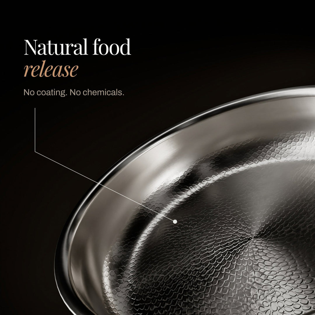Close-up detail of the hammered cooking surface on the silver frying pan.