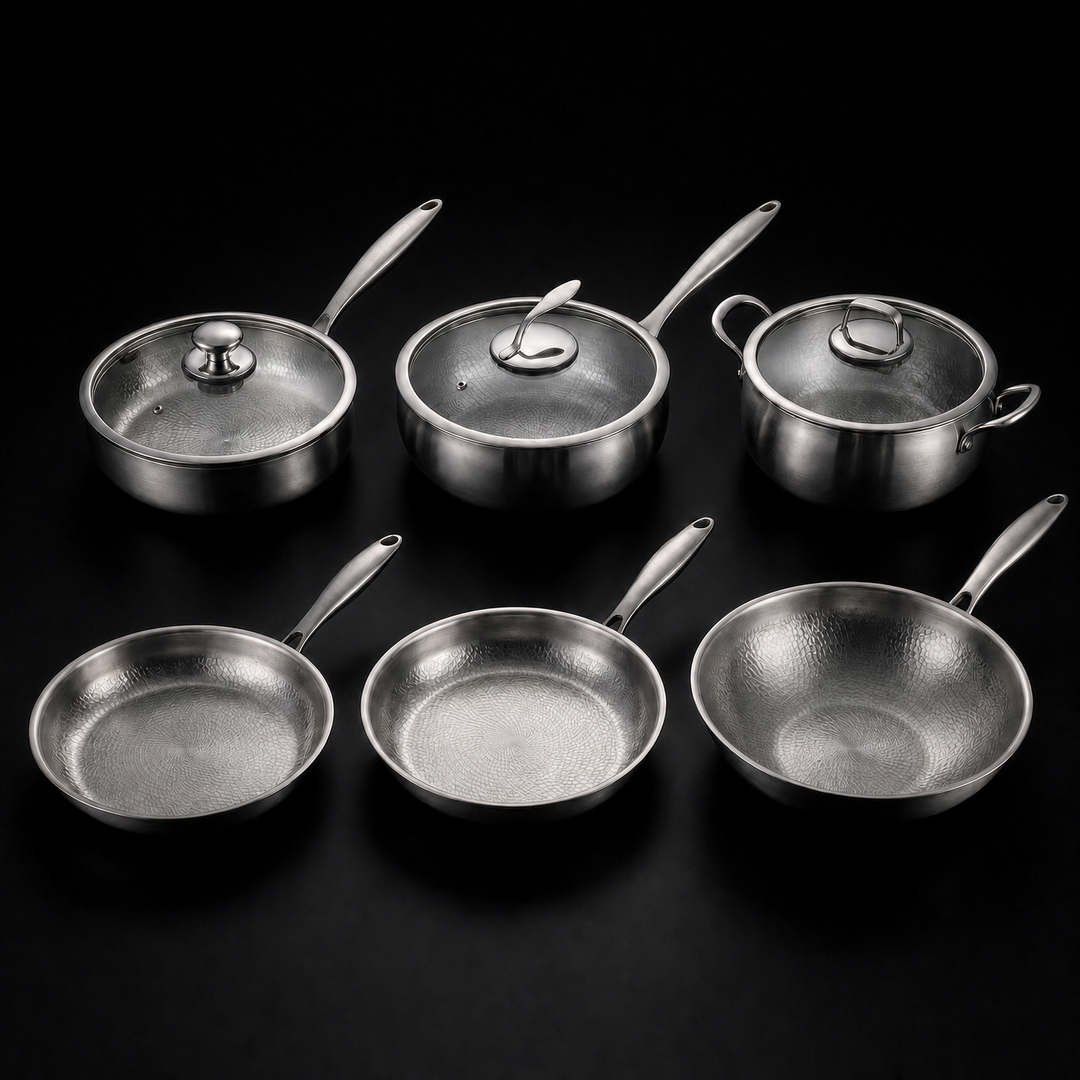 Hand-Hammered Titanium Kitchen Set with 3 Lids in silver, three lidded pots and pans and three open pieces