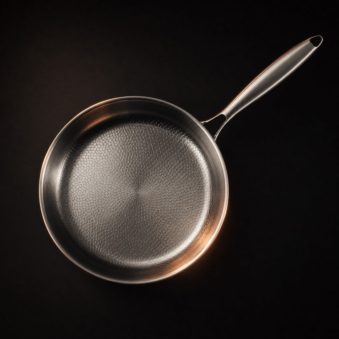 Single pan seen from directly above, showing the textured cooking surface that radiates from the center and the slim handle.