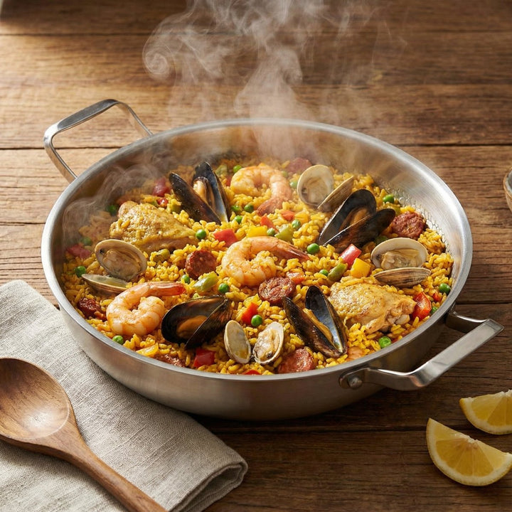 Hammered titanium pan with paella on a wooden table, another view