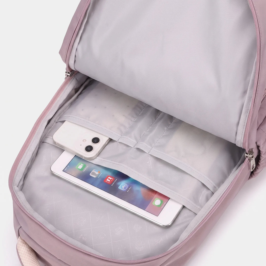 Open main compartment showing a phone and a tablet in the interior slip pockets of the gray lining. 4