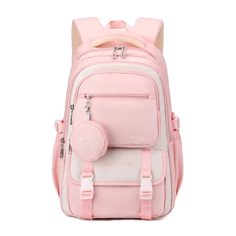 Front view of the same backpack in light pink and cream, with the round bear charm pouch and buckled flap. 7