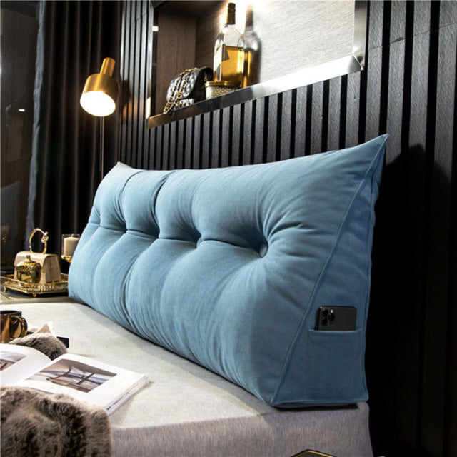 another view of a light blue tufted velvet wedge pillow.