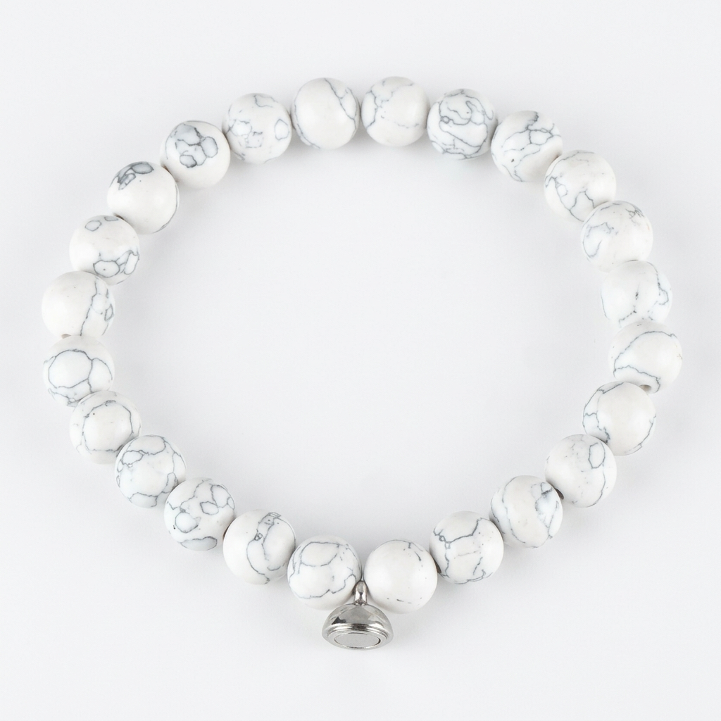 White marbled bead bracelet with gray veining and a silver magnetic charm, shown from above on white 6