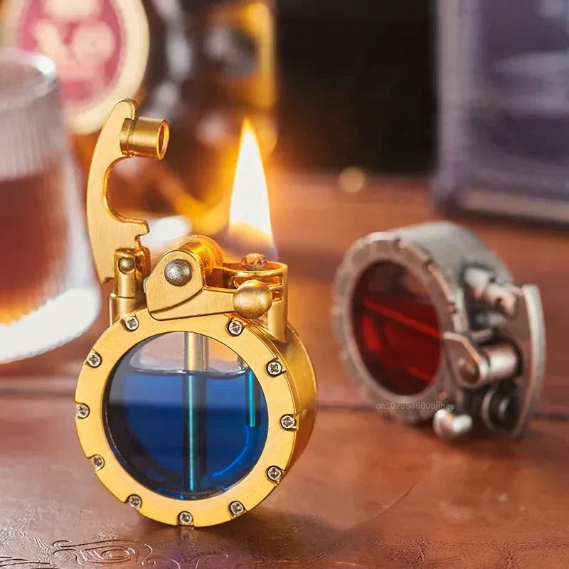 Another view of two lit lighters on a wooden table, one silver and one brass.
