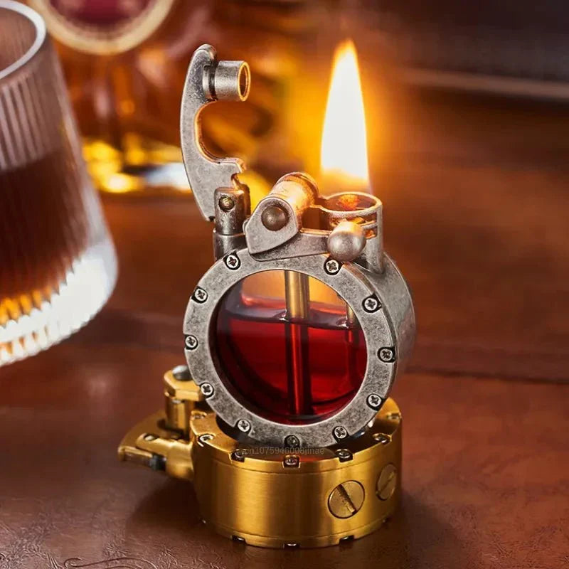 Silver vintage-style lighter with a transparent tank on a wooden table beside a whiskey glass.