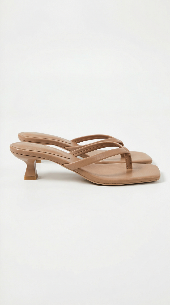 Pair of tan square-toe thong sandals with a low flared kitten heel and softly padded straps