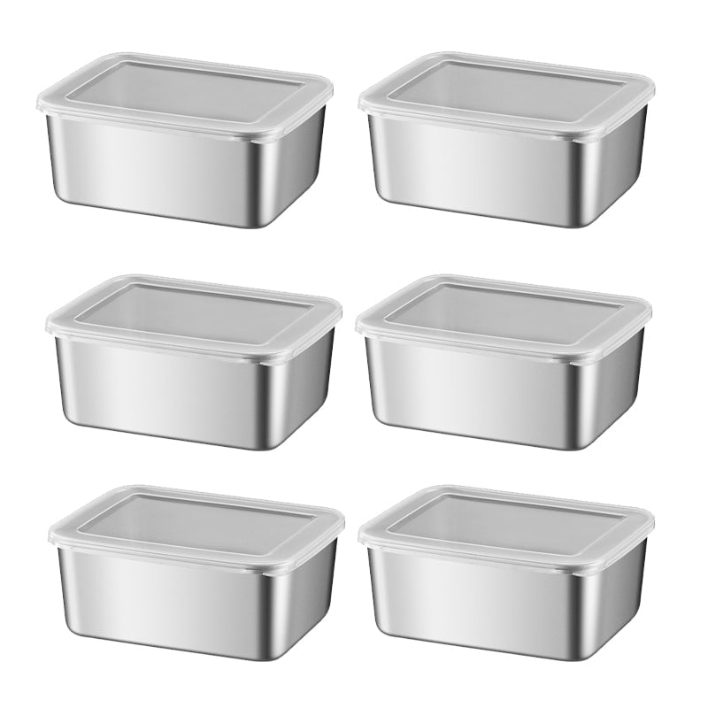 Six small stainless steel containers with clear lids arranged in two columns on white background 15