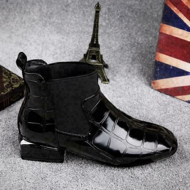 Side view of the black croc-embossed ankle boot showing the elastic gusset, pull tab and low block heel 2