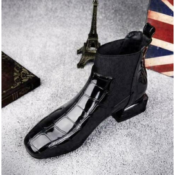 Overhead angled view of the black square-toe boot with glossy croc-style panels and elastic insert 7