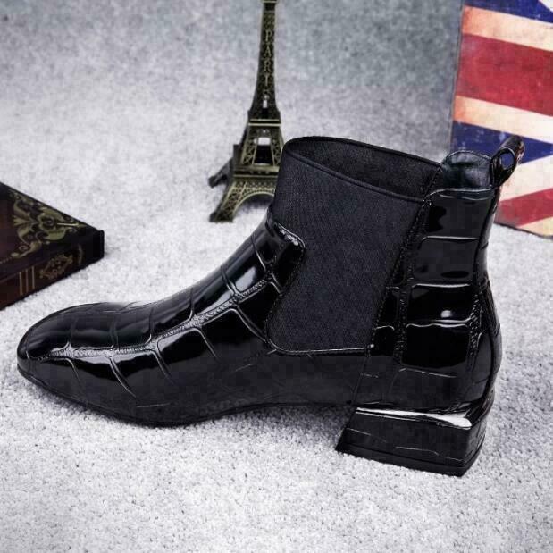 Close side profile of the shiny black boot showing the stretch panel and low square heel 6