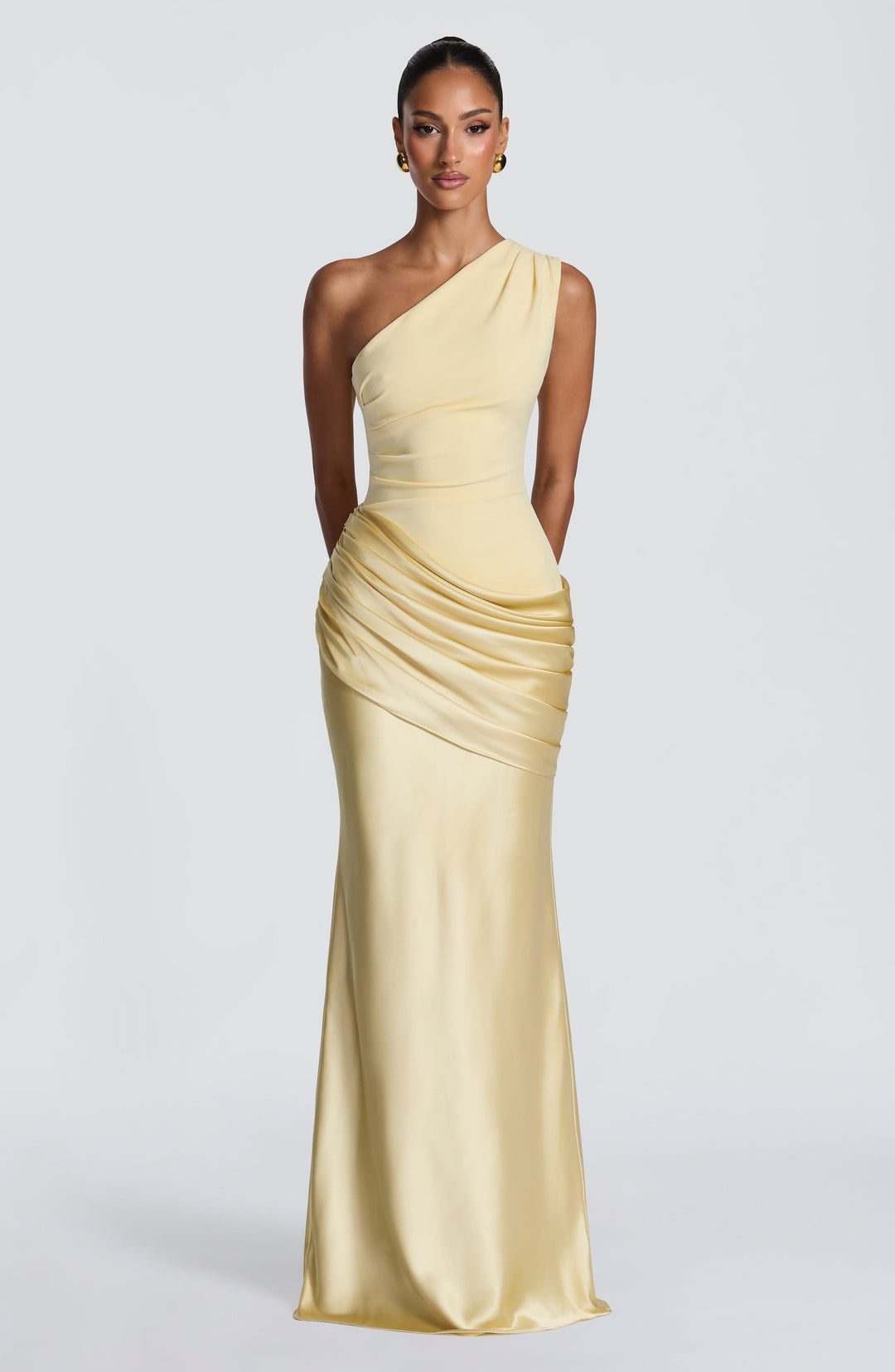 Pale yellow version of the one-shoulder maxi dress, full-length front view with a ruched satin drape across the hips. 45