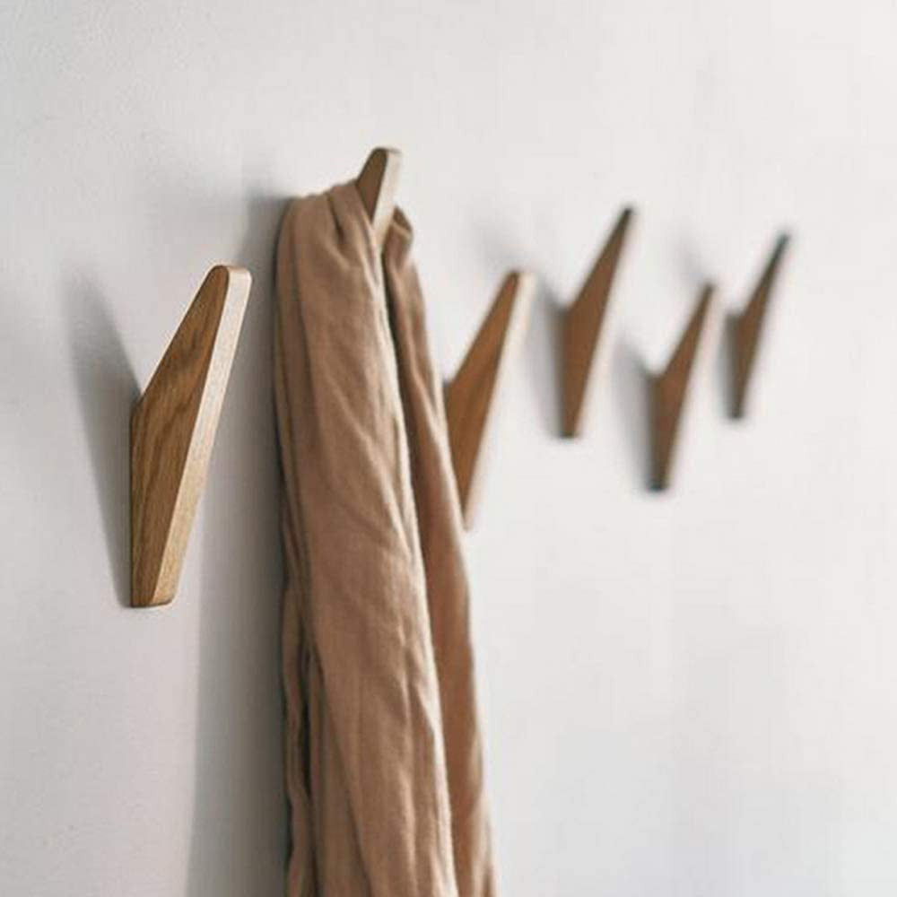 Row of angled light wooden hooks mounted on a white wall, with a tan scarf draped over one hook. 2
