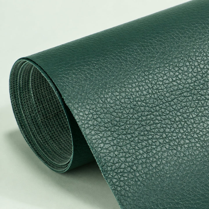 Self-Adhesive Leather Repair Patch deep green grained patch roll with mesh-textured backing.
