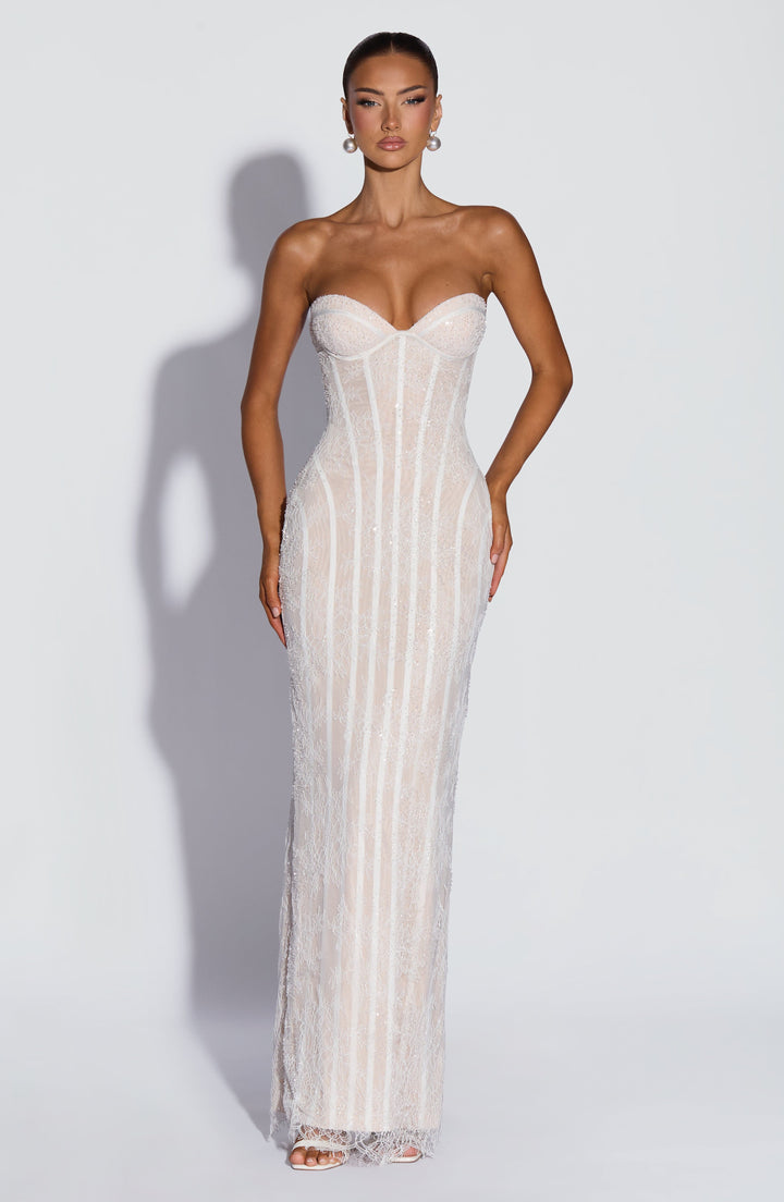 Front view of the white strapless lace maxi dress with sweetheart cups, corset boning and sparkling beaded detail over a nude lining.
