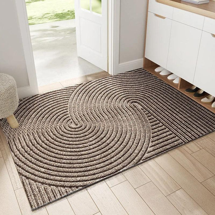 Brown doormat with overlapping circular ridges, another view.