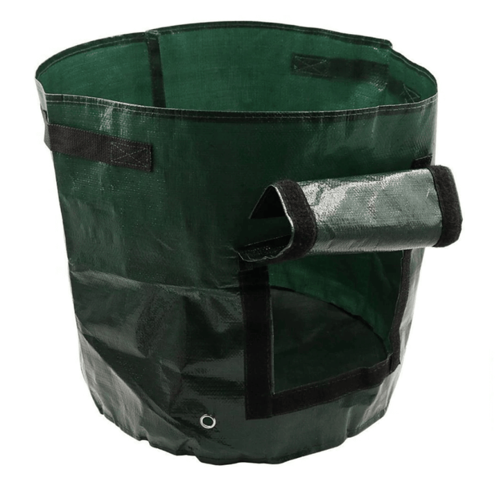 Another view of an empty green grow bag standing upright with its flap rolled up.