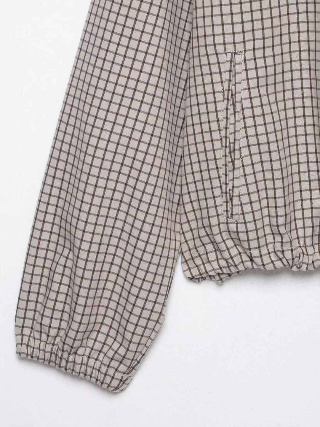 Women's Plaid Hooded Cropped Jacket detail showing the sleeve cuff, side pocket opening and gathered hem.