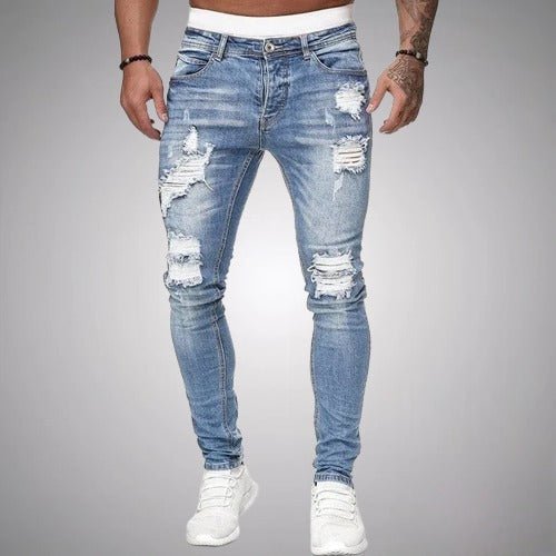 Men's slim-fit ripped jeans in light blue wash, front view, detail.