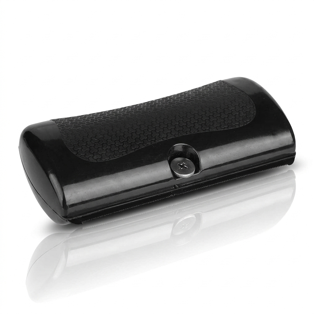 GlowBrush black grooming comb with a textured rubber grip and metal screw on a white background.