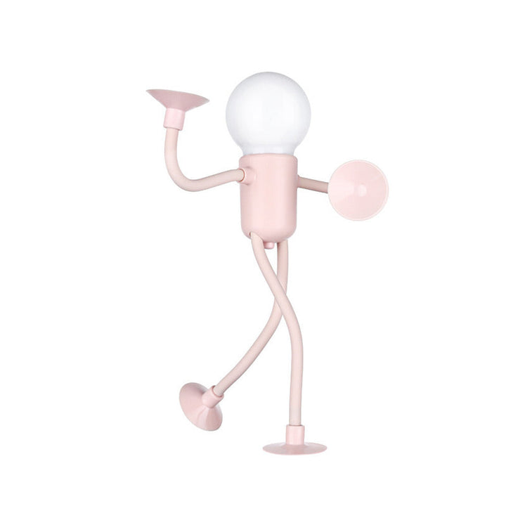 Pink figure lamp with a glowing bulb head in a playful pose on a plain background.