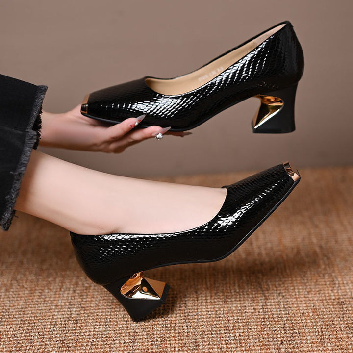 Black pair shown from two angles: one pump held up to show the beige lining and heel, the other worn on the foot. 5