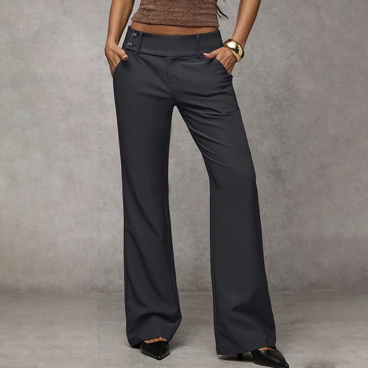 Charcoal gray wide-leg pants with hands in the pockets, another view.