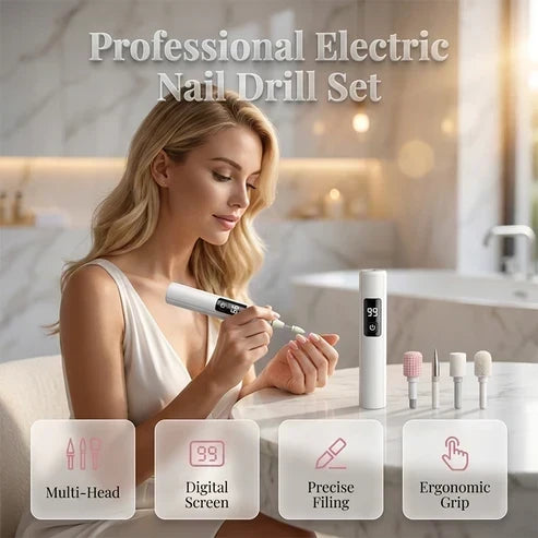 A blonde woman in a white top uses the white cordless nail drill on her fingernails at a marble vanity, with extra bits beside it. 1