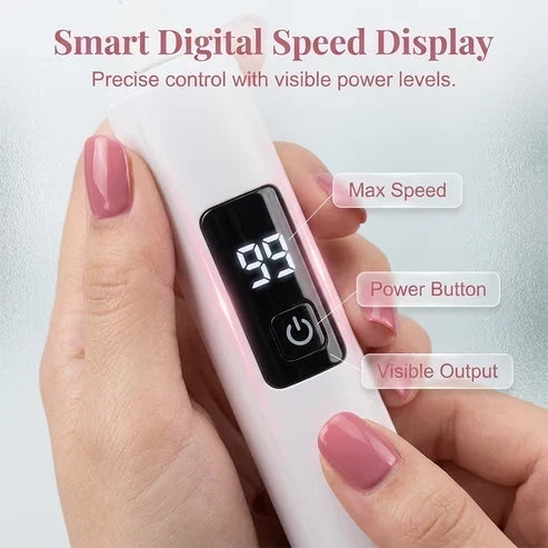 Close-up of hands holding the white drill, showing its digital speed display and round power button against pink-polished fingernails. 4