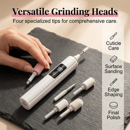 A hand places a pink grinding bit next to the white drill on a slate board, surrounded by four other interchangeable tips. 2