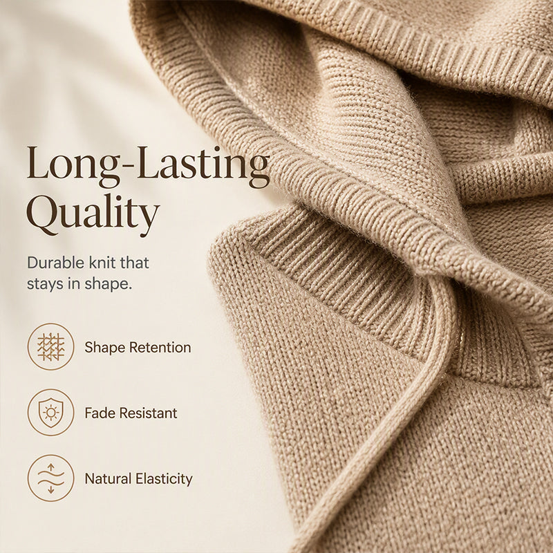 Women's beige hooded knit sweater detail showing the folded hood, ribbed trim and stitched fabric texture.
