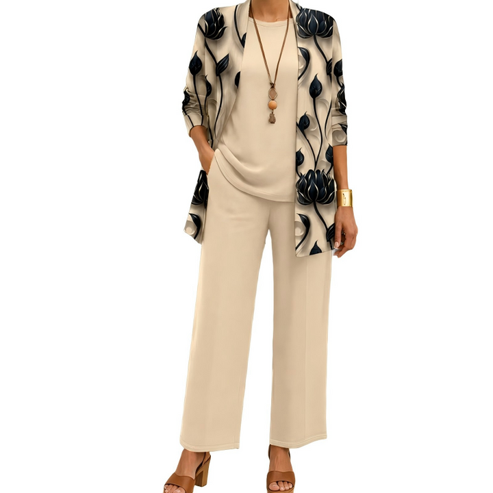 Model wears the beige set: open cardigan with black lotus flower print over a plain round-neck top and wide-leg pants. 1