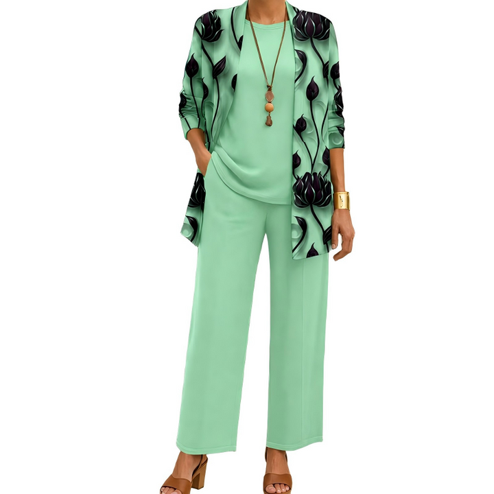 Mint green version of the set, with a dark lotus flower print on the open cardigan and matching top and pants. 6