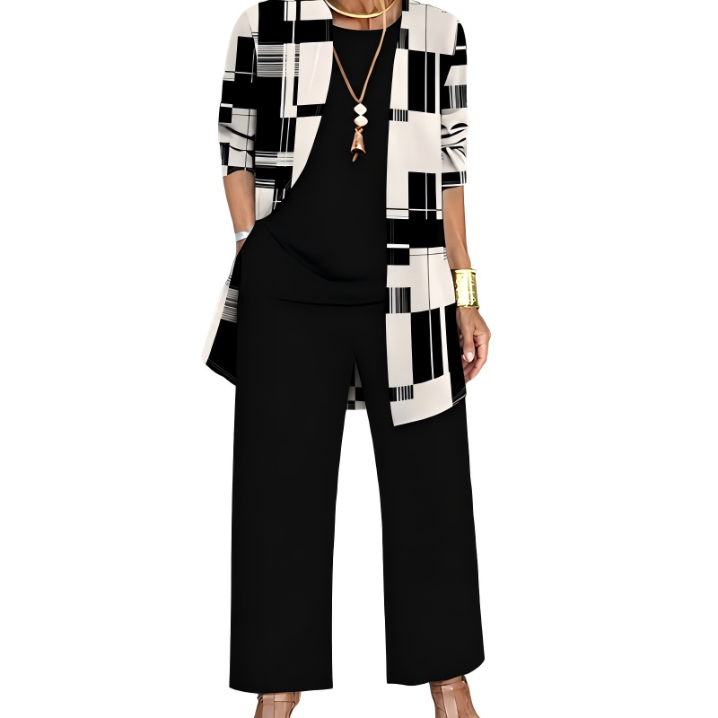 Black and cream version, the cardigan in a geometric block pattern over a black top and wide-leg black pants. 8